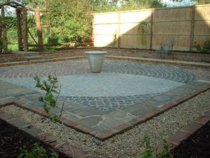 Courtyard garden contructed using three coloured granite setts